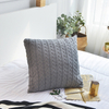 Housse de coussin en tricot épais 100 % coton.